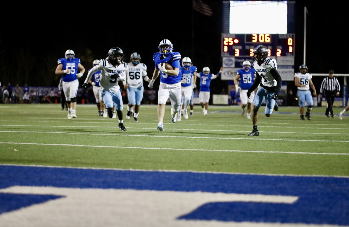 Running back Jack White(12) runs into the endzone for a  33-yard rushing touchdown vs Collins in the first round of playoffs.